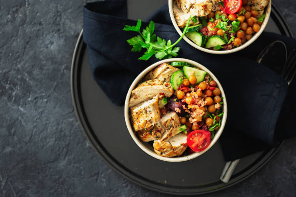 istock Two bowl buddha. Healthy eating plate top view on dark background copy space 1150434820