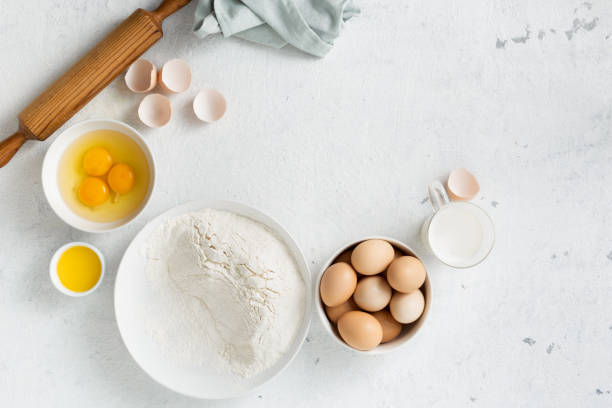 istock Dough ingredients on white background top view 1150435004