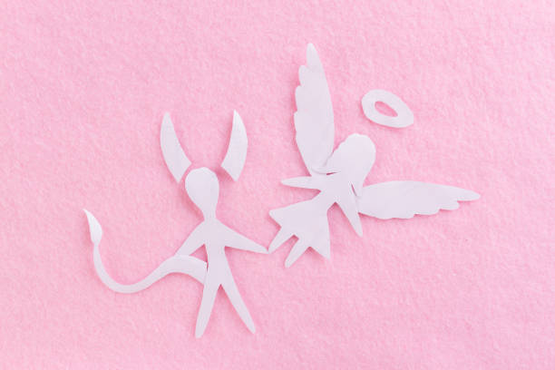 istock devil man and angel woman 1150437998
