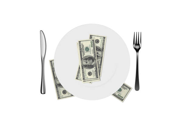 istock Blank White Plate and Fork, Spoon, Knife with Dollar Banknotes on White 1150439695