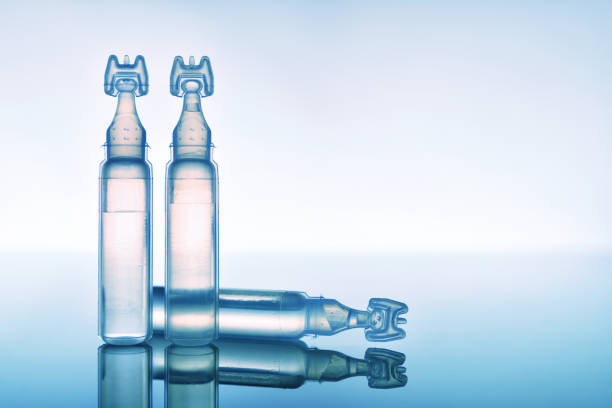 istock Lubricant eye drops in plastic pipettes blue background close up 1150440958