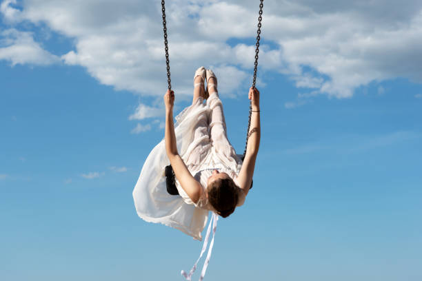 istock Female Ballet Dancer Swinging Against Blue Sky 1150448452