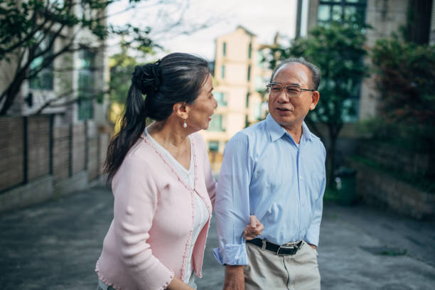 married senior couple taking a walk - active seniors enjoyment driveway vitality imagens e fotografias de stock