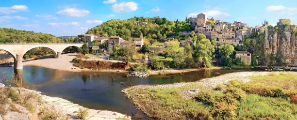 Panoramic view of the picturesque village and the bridge that spans the river.