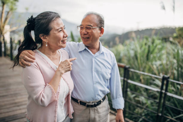 istock Senior couple hugging on terrace at home 1150448998