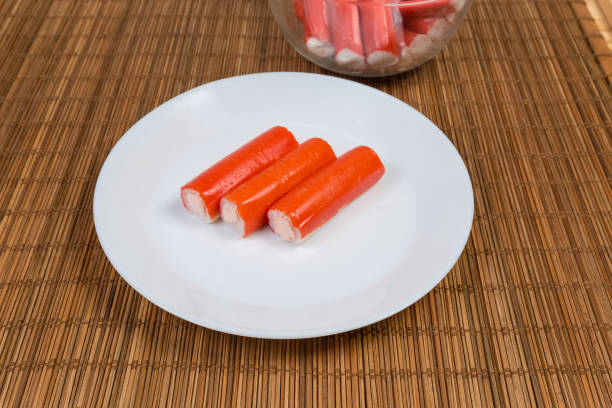 istock Crab sticks stuffed with cheese spread on a white dish 1150452406
