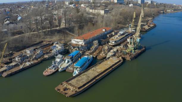 istock Old repair dock - barge with a crane on the river 1150454832