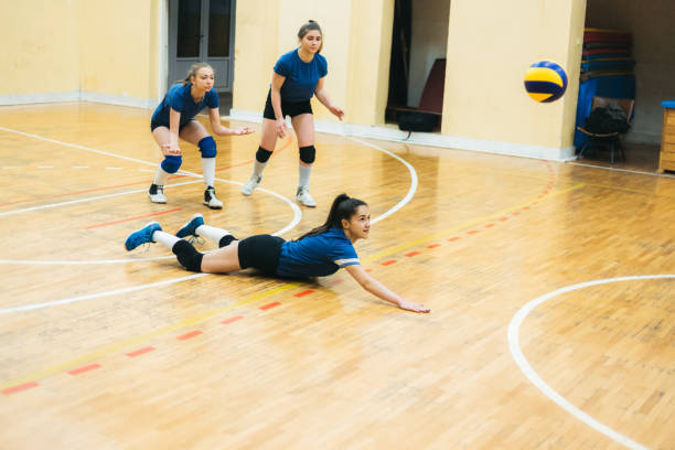 istock Female volleyball player digs 1150455111