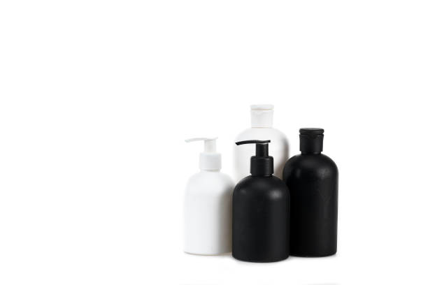 istock Black and white cosmetic bottles isolated on white 1150455916