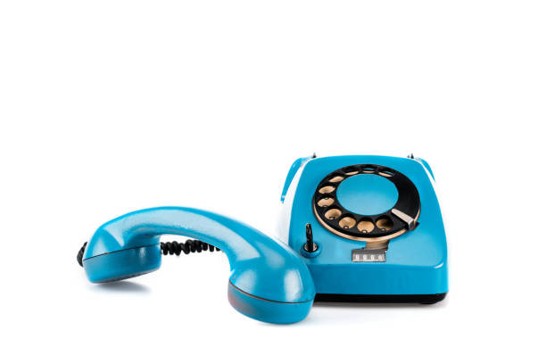 istock Blue vintage telephone with handset and wire on white 1150456628