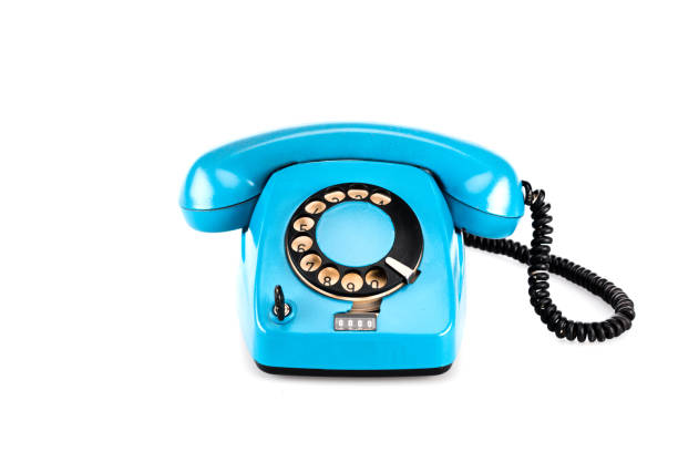 istock Blue vintage telephone with handset and wire on white 1150456634
