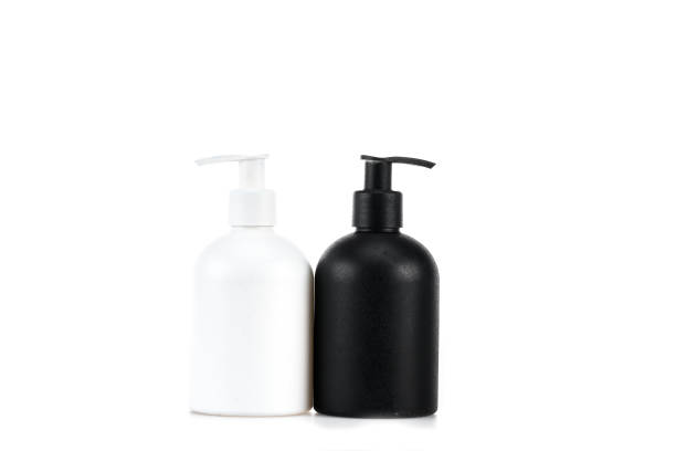 istock Black and white cosmetic bottles isolated on white 1150456687