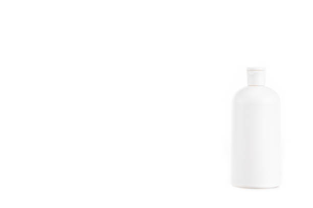 istock White cosmetic bottle with cap isolated on white 1150456698