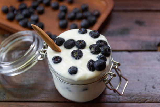 istock fresh Blueberries with yogurt in glass 1150457018
