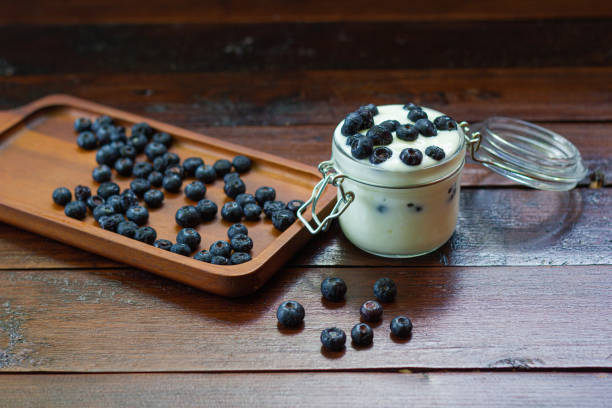 istock fresh Blueberries with yogurt in glass 1150457058