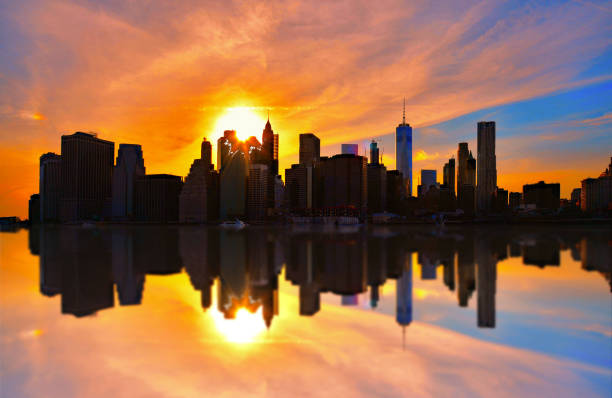 istock Manhattan downtown skyline in lower manhattan financial district with modern skyscrapers over river with water reflections. New York 1150458307