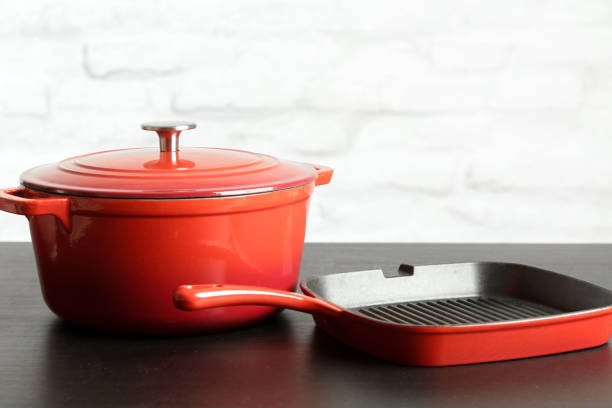 istock Cookware set: Red enameled cast iron pot, saucepan 1150458587