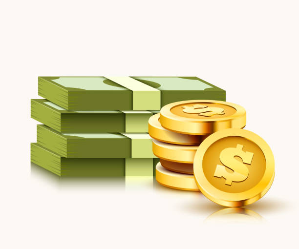 istock Stack of paper dollars and golden coins isolated on white background. 1150458799