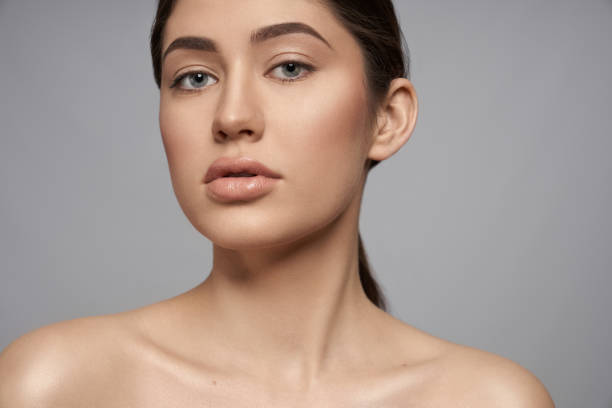 istock Sexy brunette posing on grey isolated background 1150459253