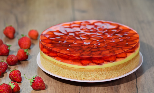 Fresh baked cake with strawberry jelly topping