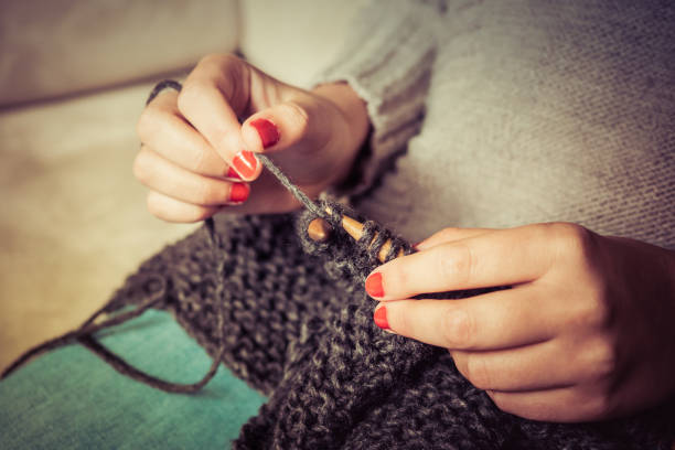 istock knitting dark gray wool with wooden needles 1150461959