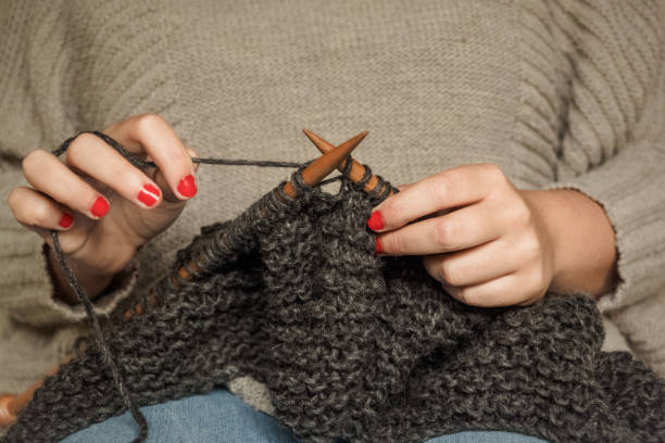 istock knitting dark gray wool with wooden needles 1150461962