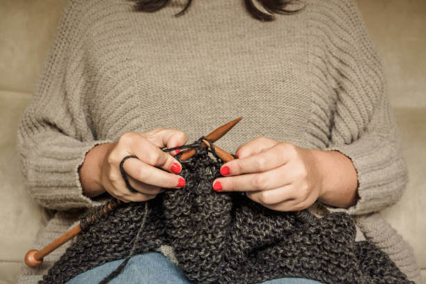 istock knitting dark gray wool with wooden needles 1150462049