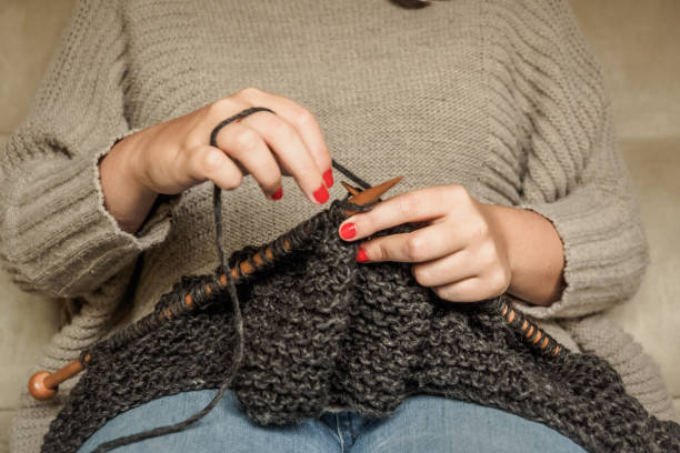 istock knitting dark gray wool with wooden needles 1150462092