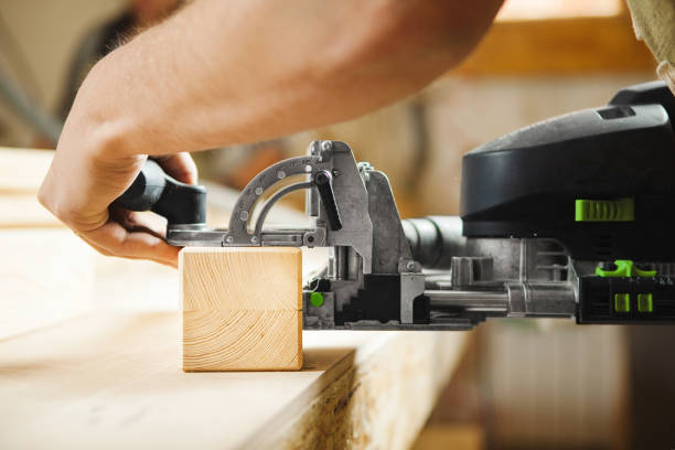 istock Man working with carving equipment in workshop. Electronic device 1150465181