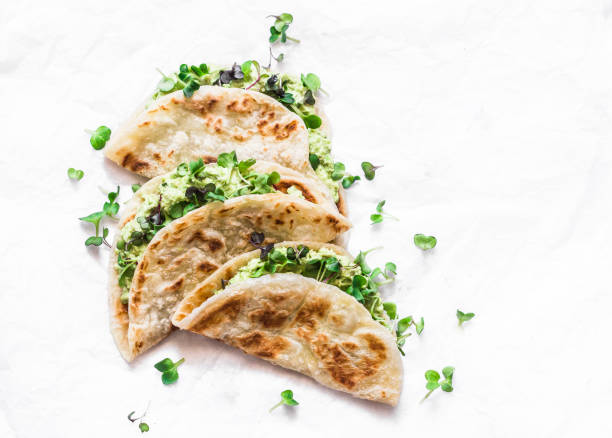 istock Avocado micro greens quesadilla on a light background, top view 1150465361