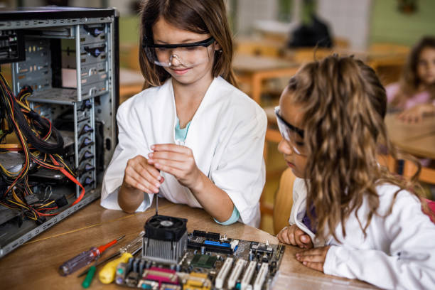 istock Elementary students repairing computer mother board during a class in the classroom. 1150470167
