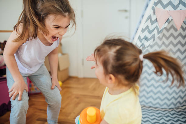 istock Girls playing at home 1150470291