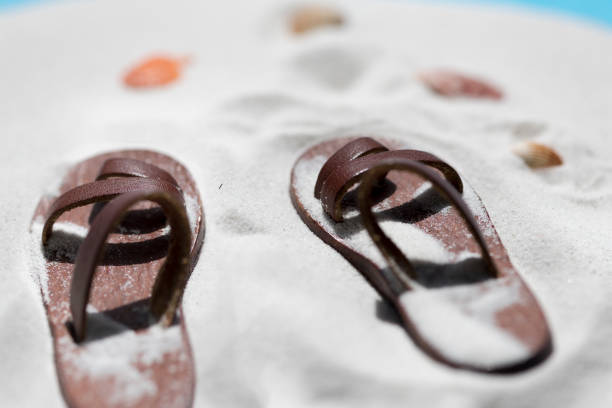 Sandy lace up shoes on a beach