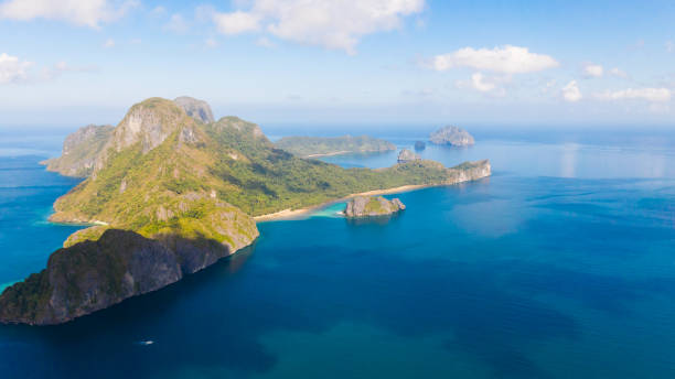 istock Seascape, view from above. Rocky islands covered with rainforest 1150471852