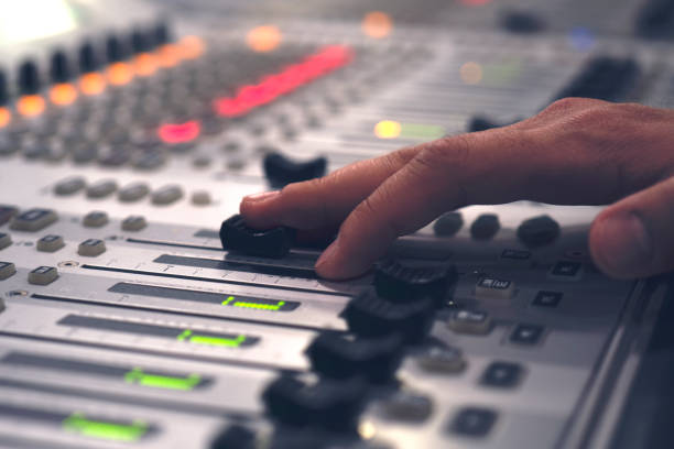 istock Professional audio mixing console with faders and adjusting knobs - radio / TV broadcasting 1150472091