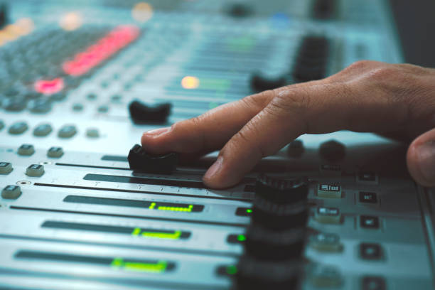 istock Professional audio mixing console with faders and adjusting knobs - radio / TV broadcasting 1150472833