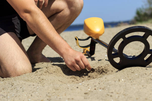 istock metal finder search on the beach 1150475421