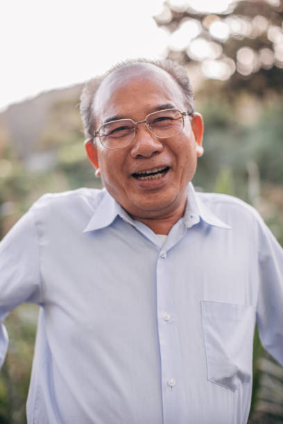 istock Senior man standing on balcony 1150475451