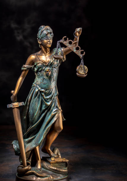 Photography of bronze Themis sculpture, Femida or justice goddess on dark background. With coins on scales Photography of bronze Themis sculpture, Femida or justice goddess on dark background. With coins on scales supreme court justice photos stock pictures, royalty-free photos & images