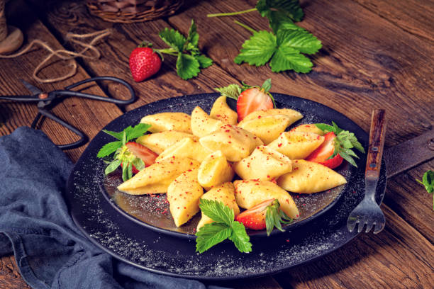 istock Kopytka - polish potato dumpling with strawberries 1150478939