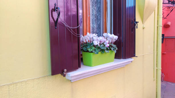 istock Authentic window with green shutters in Mediterranean style old window against stone wall 1150479355