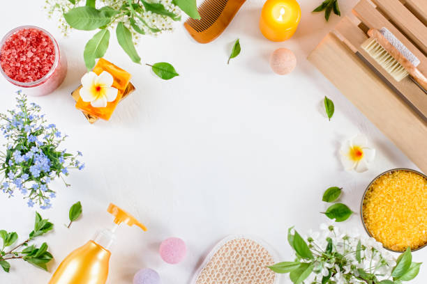 istock Spa and bath accessories with bath salts and beauty treatment products on white table. Wellness concept 1150481122