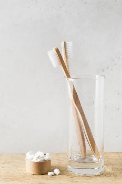 istock Zero waste, sustainability and minimalism concept. Wooden ecological bathroom accessories on white background 1150490000