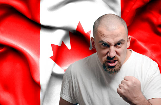 istock Angry man against flag of Canada 1150490742