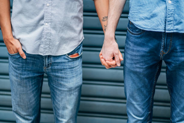 istock Gay couple holding hands 1150491826