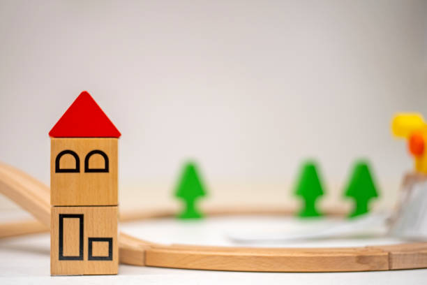 istock Model houses and trees on cream background 1150492292