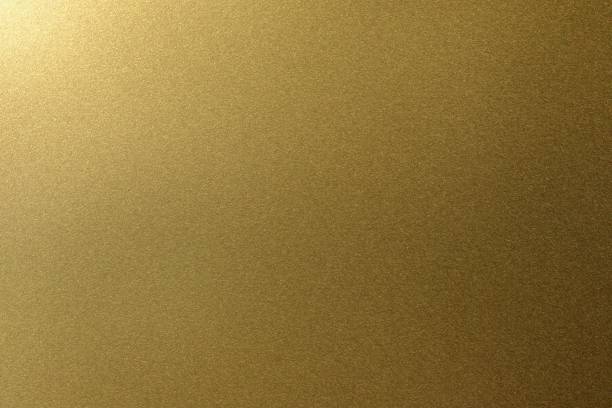 istock Light shining on golden metal plate, abstract texture background 1150493354