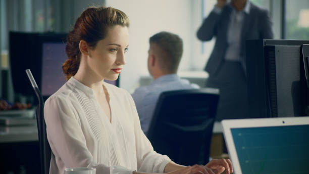 istock Woman satisfied with her work. Businesswoman looking at computer 1150496014