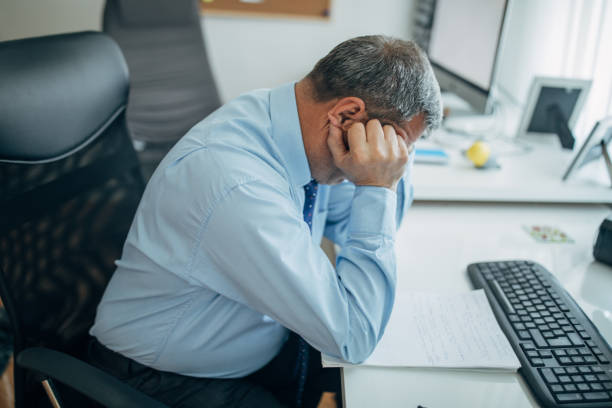 istock Mature businessman works in the office 1150499342