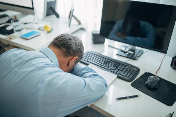 istock Mature businessman works in the office 1150499983